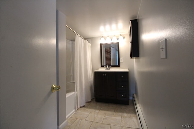 bathroom with vanity, shower / bathtub combination with curtain, and a baseboard heating unit