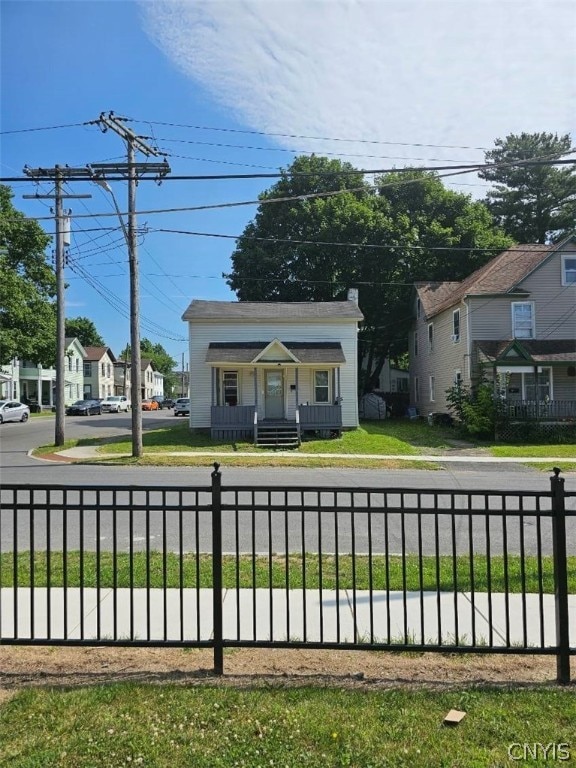 bungalow-style house featuring a front yard