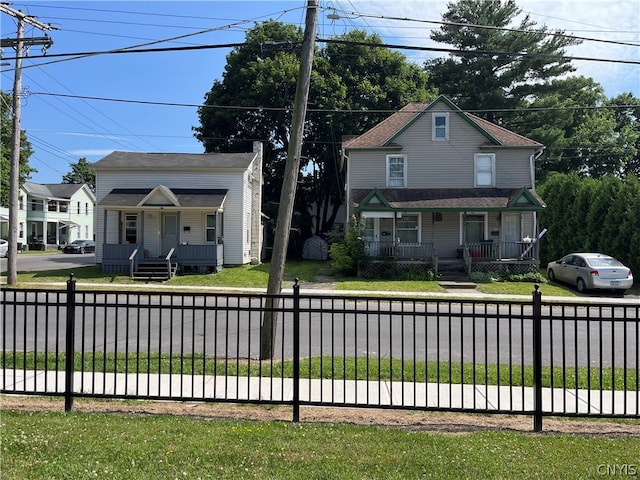 view of front of house featuring a porch and a front lawn