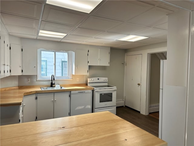 kitchen featuring sink, white cabinets, dark hardwood / wood-style floors, and white appliances