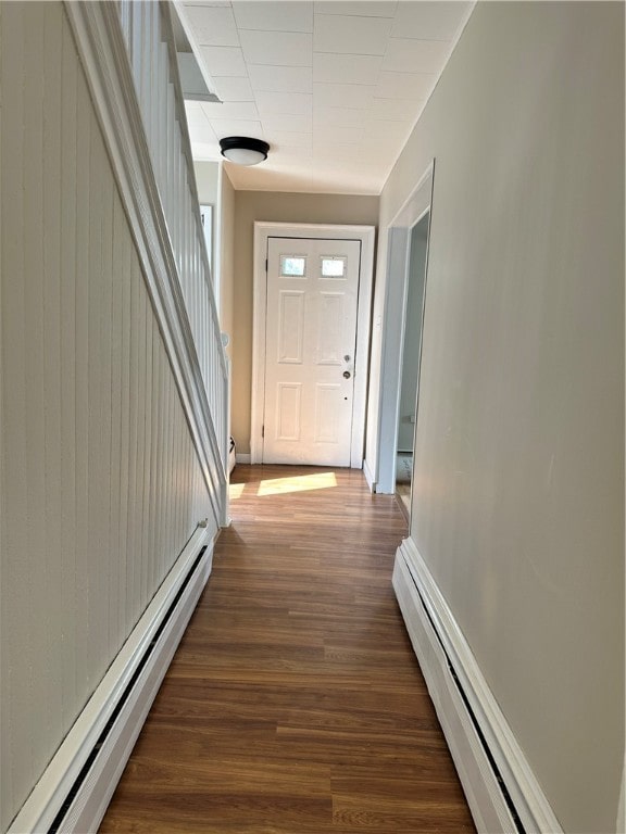 hallway with a baseboard radiator and wood-type flooring