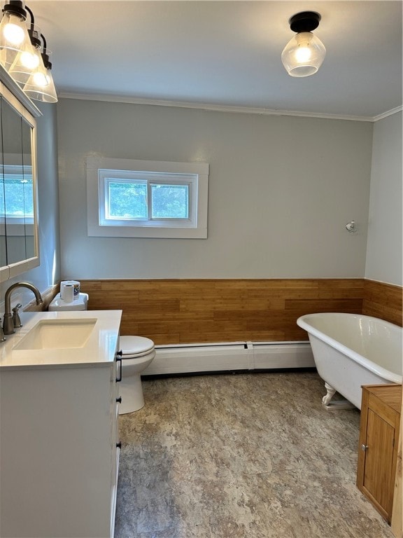 bathroom with tile patterned flooring, a baseboard heating unit, toilet, vanity, and ornamental molding