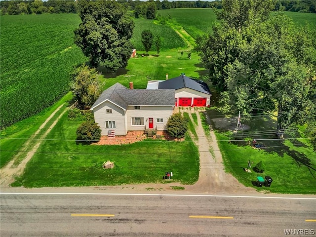 birds eye view of property with a rural view