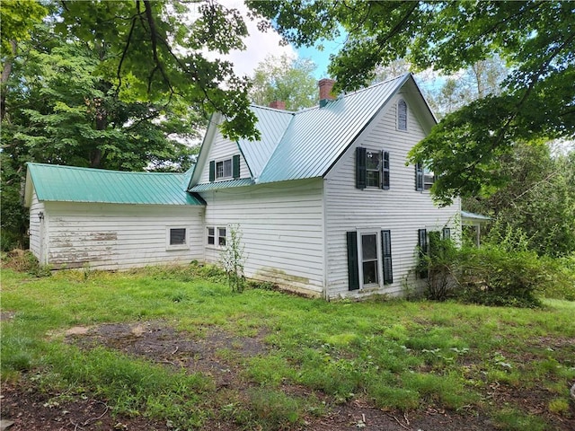 rear view of house with a lawn