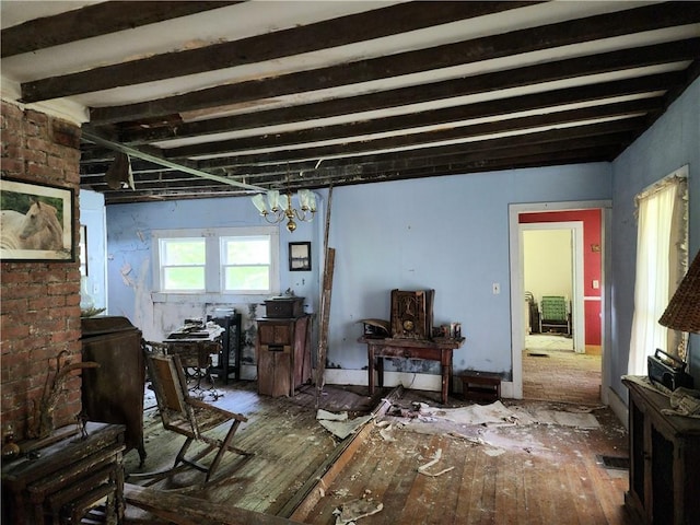 miscellaneous room featuring a notable chandelier and beamed ceiling