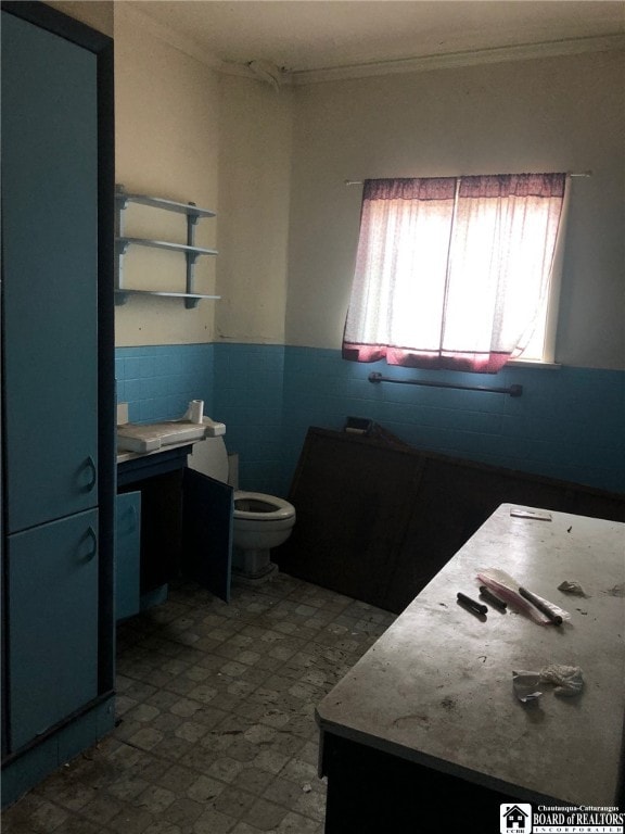 bathroom with vanity, tile patterned flooring, and toilet