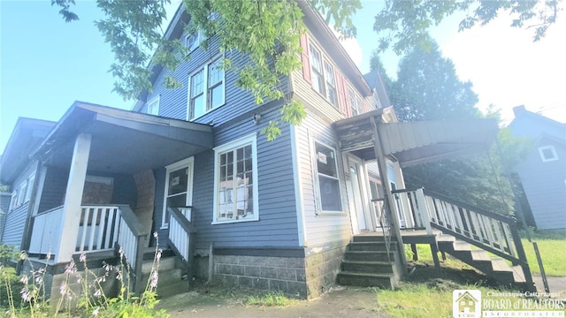 view of front of home featuring covered porch