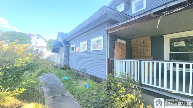 view of home's exterior with covered porch