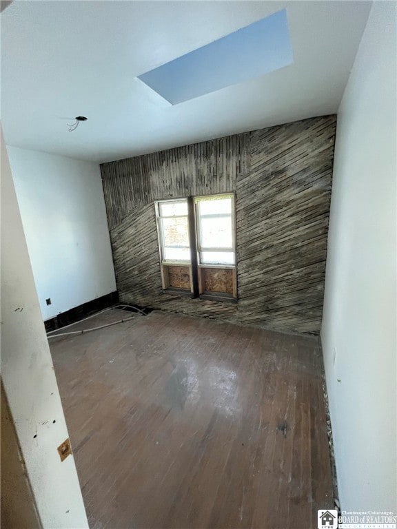 spare room featuring hardwood / wood-style floors