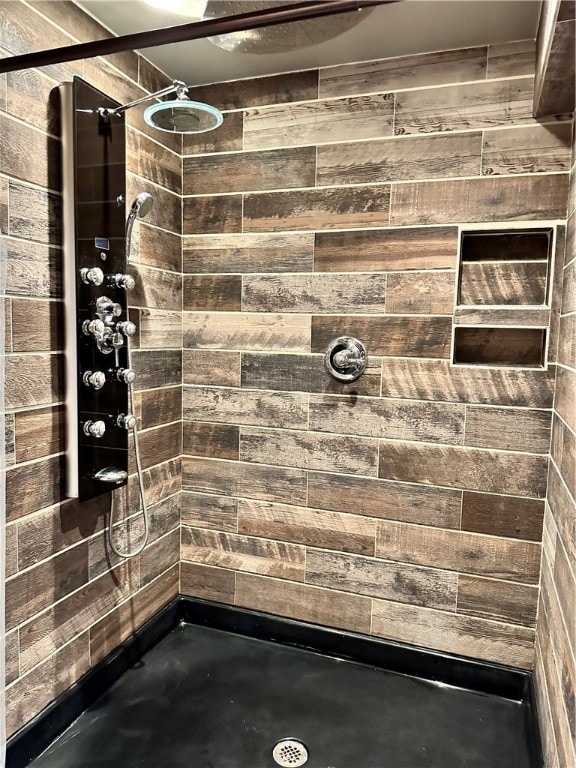 bathroom with a tile shower