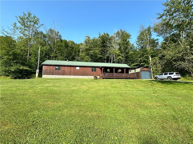 exterior space featuring a garage and an outdoor structure