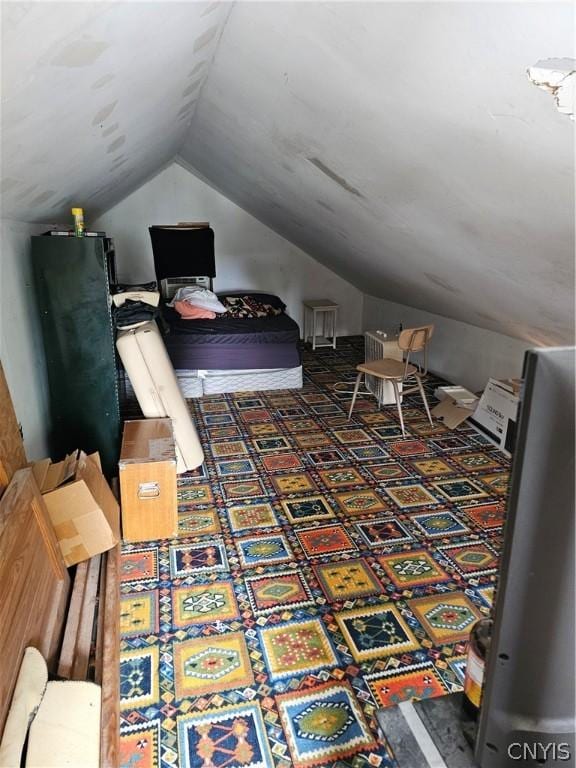 bedroom with lofted ceiling