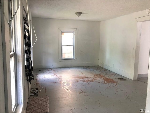 spare room featuring a textured ceiling