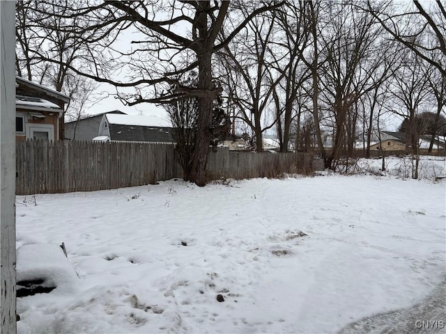 view of yard layered in snow