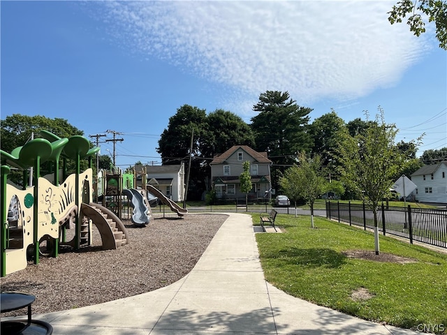 view of jungle gym with a lawn