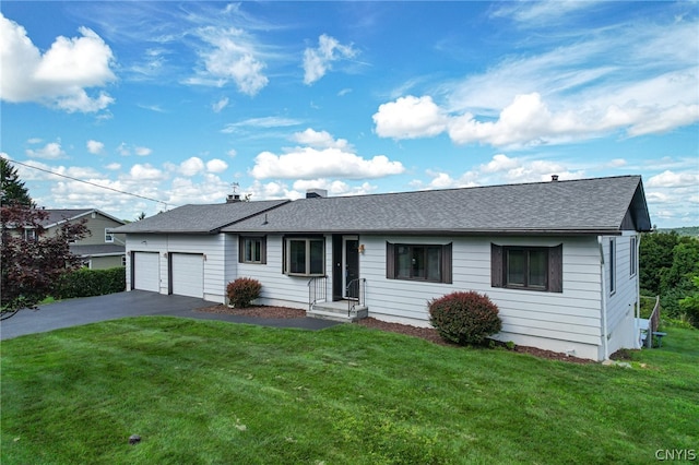 ranch-style home with a garage and a front lawn