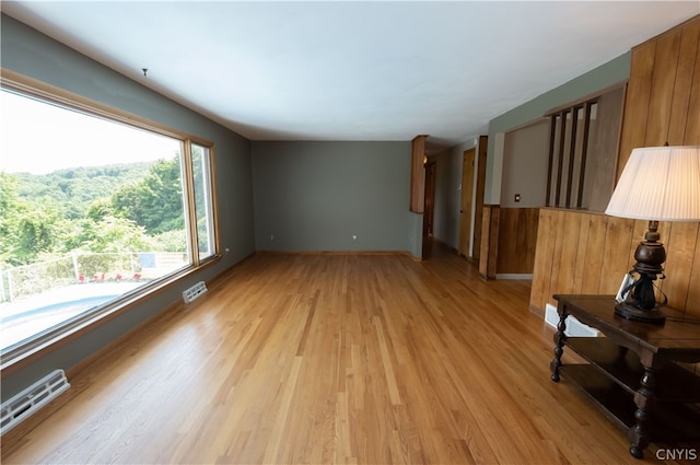 unfurnished living room featuring light hardwood / wood-style flooring