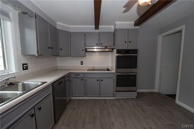 kitchen with dishwashing machine, wood-type flooring, ceiling fan, beamed ceiling, and double oven