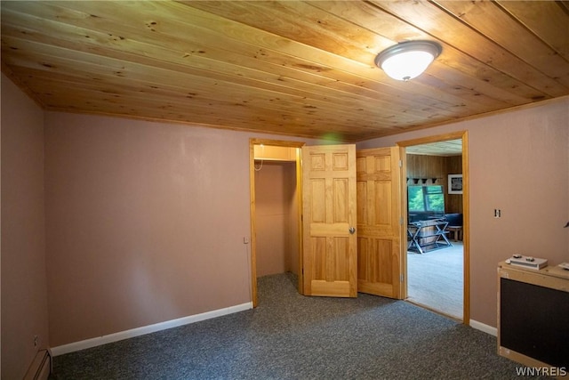 unfurnished bedroom with a baseboard radiator, carpet, and wood ceiling