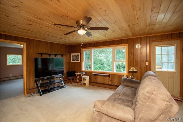 carpeted living room featuring wood ceiling, wooden walls, and a baseboard heating unit