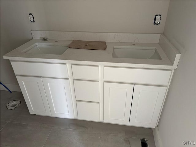 bathroom with tile patterned flooring and vanity