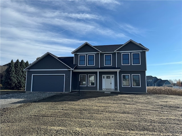 view of front of property with a garage