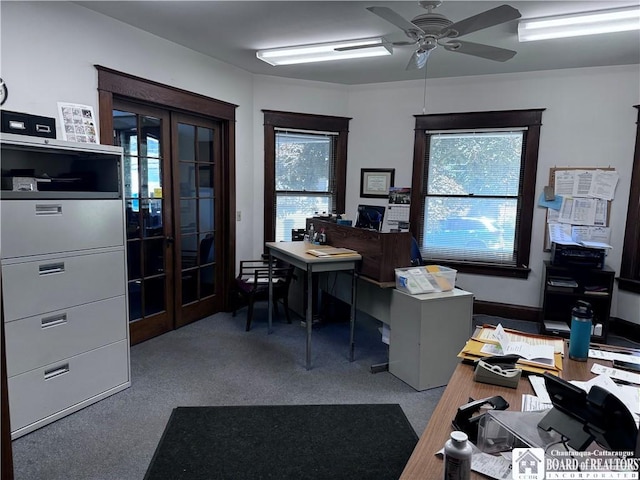 office with carpet floors, a wealth of natural light, and french doors