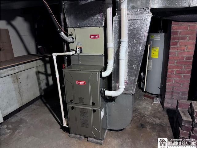 utility room with heating unit and gas water heater