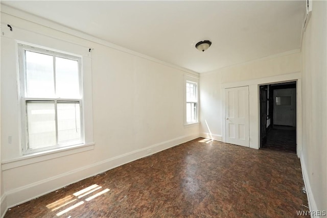 spare room with crown molding