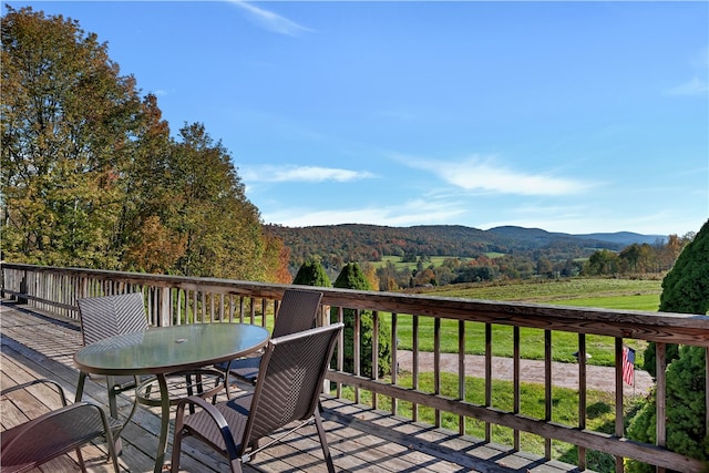 wooden terrace with a mountain view