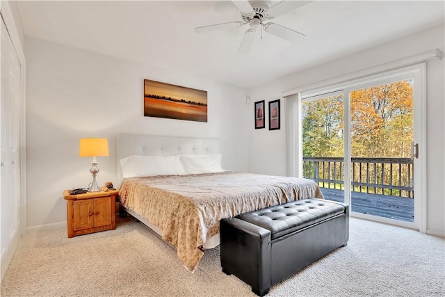 carpeted bedroom featuring access to exterior and ceiling fan