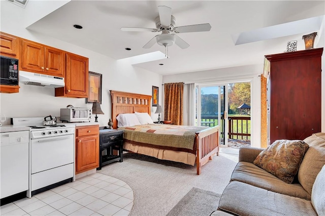 bedroom featuring light tile patterned flooring, ceiling fan, and access to outside