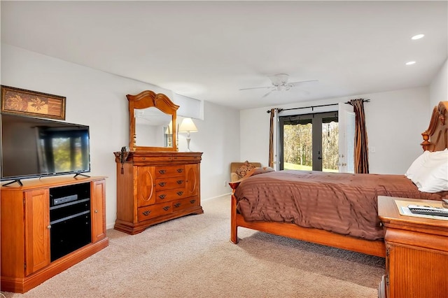 bedroom with ceiling fan, light colored carpet, french doors, and access to outside