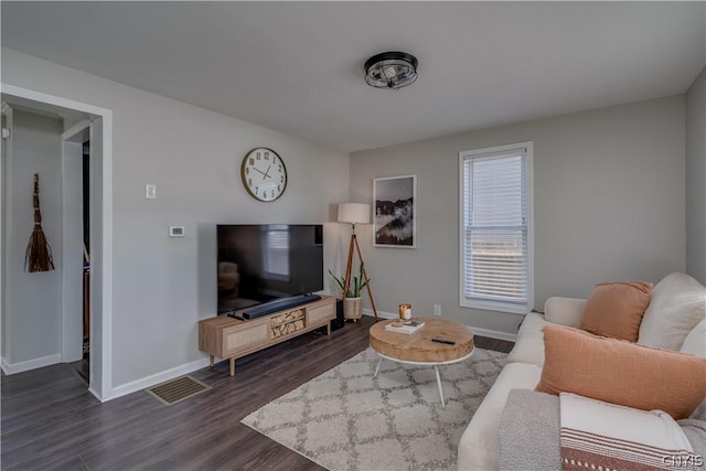 living room featuring dark hardwood / wood-style floors