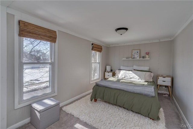 bedroom with crown molding and light colored carpet