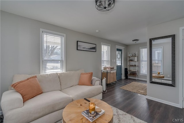 living room featuring dark wood-type flooring