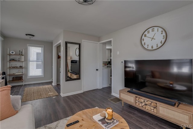 living room with dark hardwood / wood-style flooring