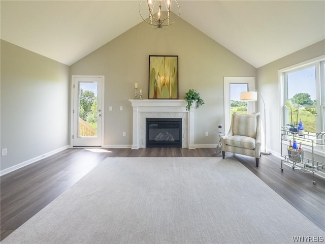 unfurnished room with dark wood-type flooring, lofted ceiling, and a fireplace