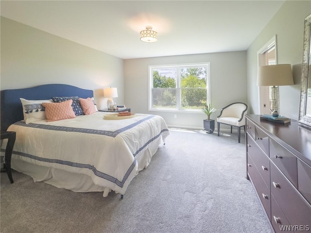 bedroom with light colored carpet