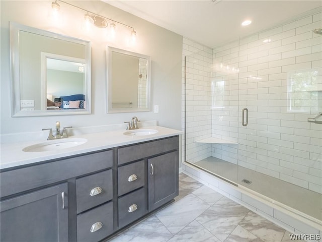 bathroom featuring walk in shower and vanity