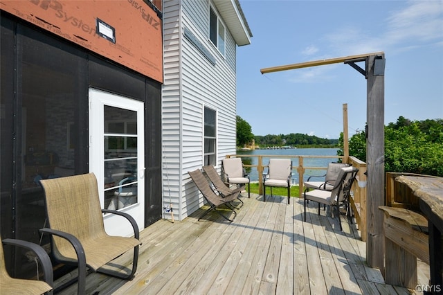 wooden terrace with a water view