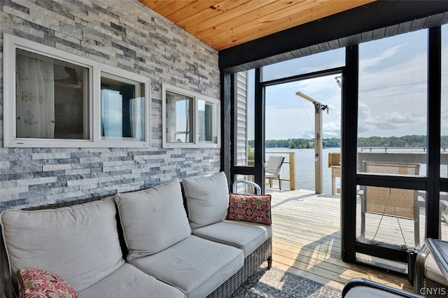 living room with a water view, light wood-type flooring, and wood ceiling