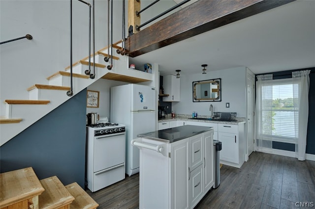 kitchen with white cabinets, white appliances, sink, a kitchen island, and dark wood-type flooring