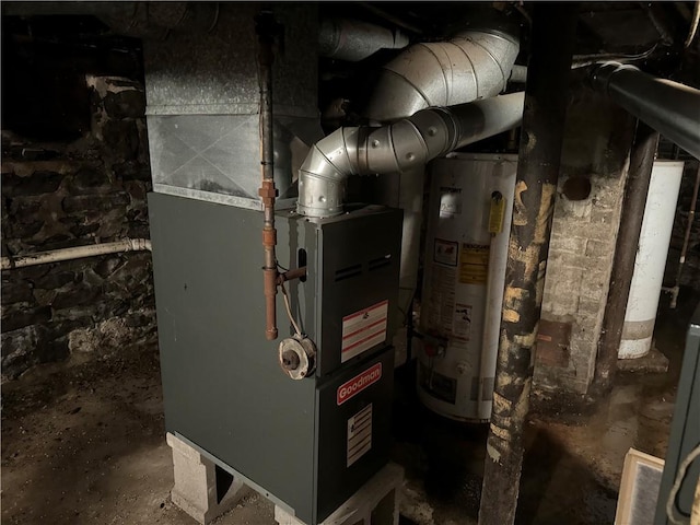 utility room featuring water heater