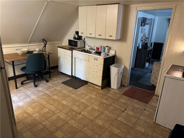 office area with light tile patterned flooring and sink