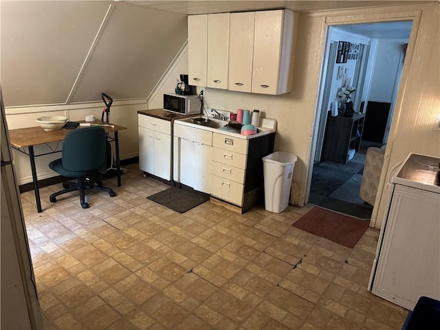 home office featuring washer / dryer and sink