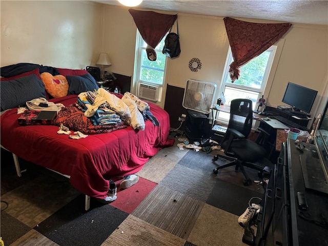 carpeted bedroom with multiple windows and cooling unit