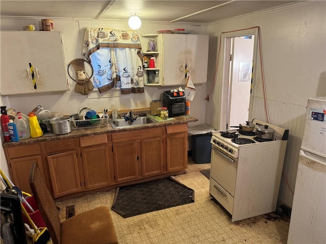 kitchen featuring sink and white electric range