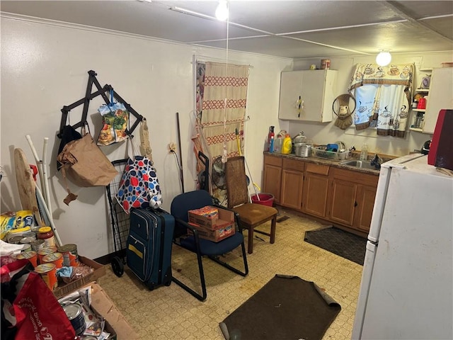 interior space featuring sink and white refrigerator