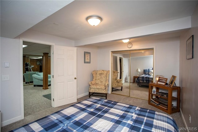 bedroom featuring a closet, carpet flooring, and baseboards